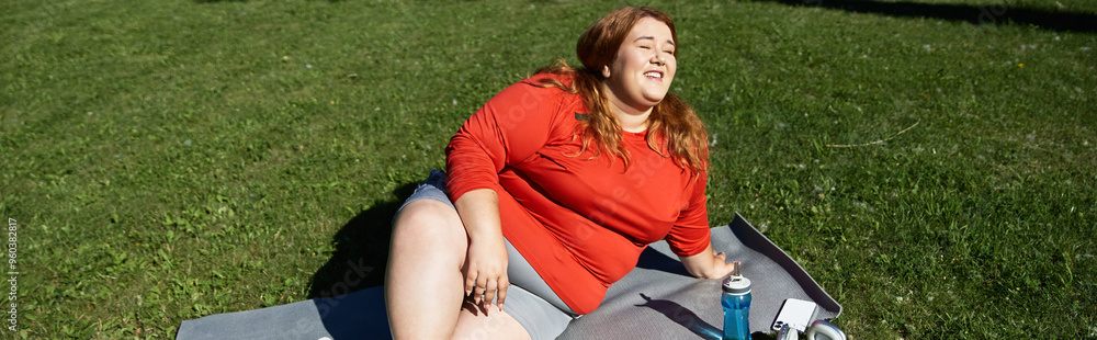 A joyful woman engages in exercise while soaking up the sun in a park.
