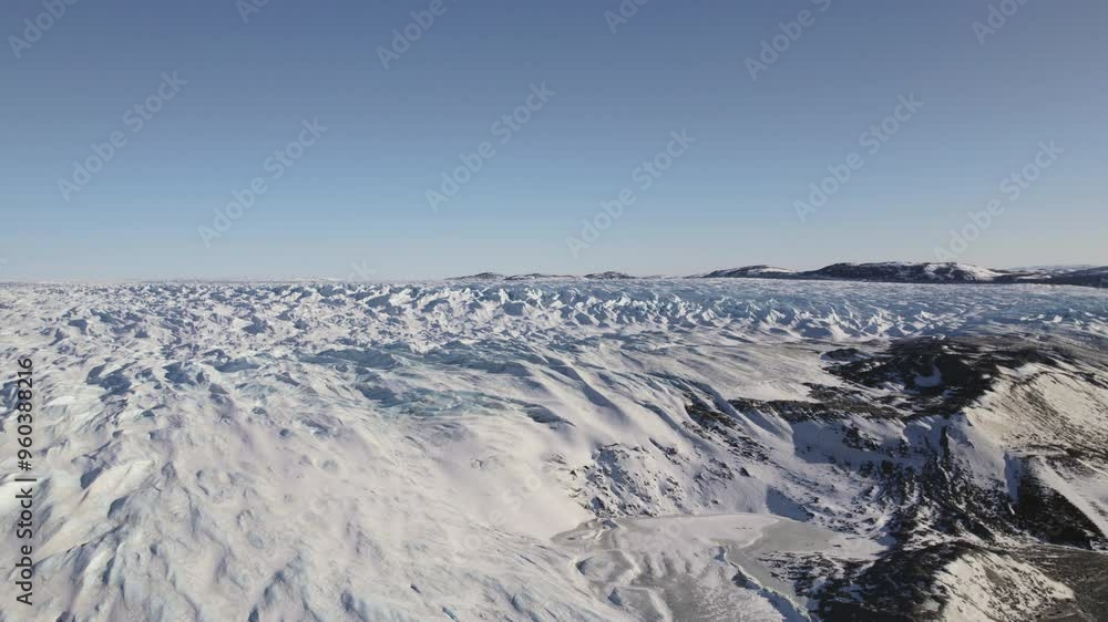 Aerial View Of Greenlands Snow-Covered Terrain During Daytime Aerial View Of Greenlands Snow-Covered Terrain During Daytime