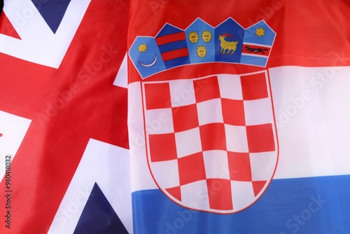 Croatian and British flags displayed together during a cultural event photo