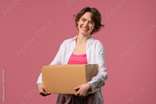 Excited smiling woman, online shopping consumer received cardboard order parcel box, desired purchase. Home courier delivery service. Sale, discounts