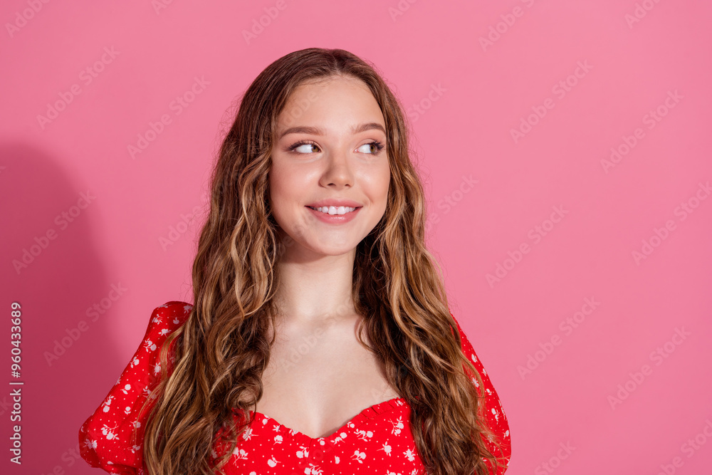 Photo portrait of pretty teen girl look empty space wear trendy red outfit isolated on pink color background Photo portrait of pretty teen girl look empty space wear trendy red outfit isolated on pink color background