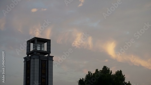 Chinese city tower, during a cloudy sunset in China Huangshan