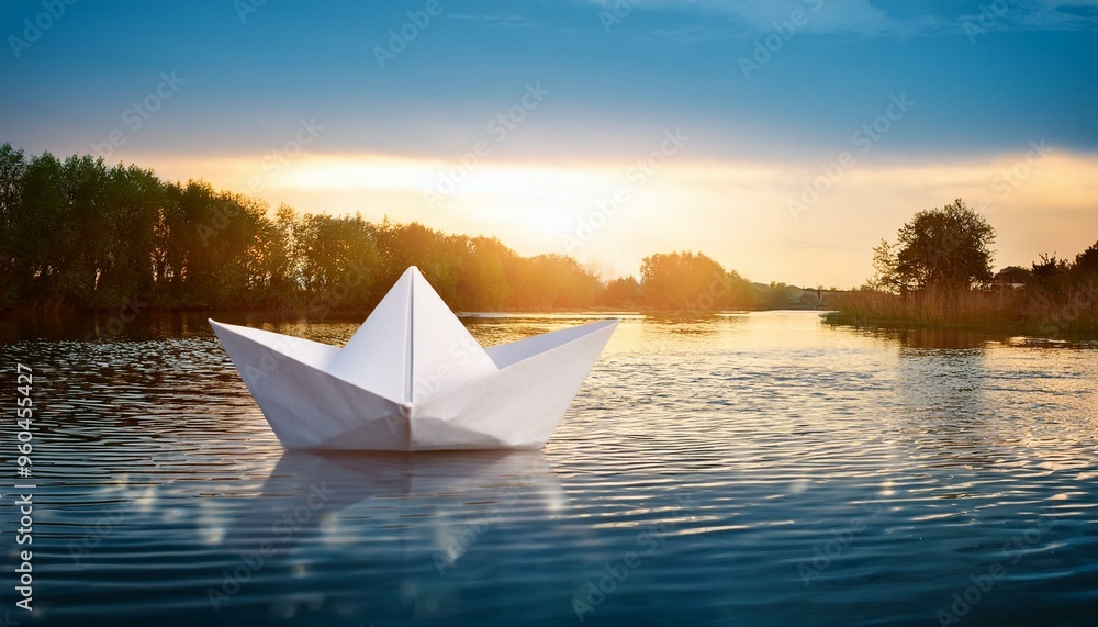 Obraz premium A paper boat on the body of water, origami art