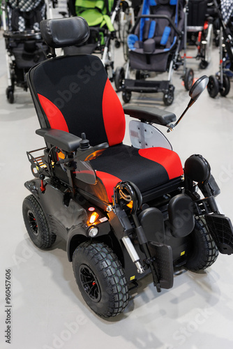 Wheelchairs with an electric motor in a store or at an exhibition.