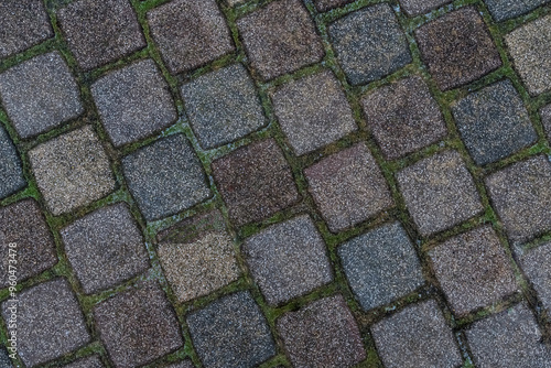 Stone texture. Square tiles in brown and gray shades in even layers at an angle