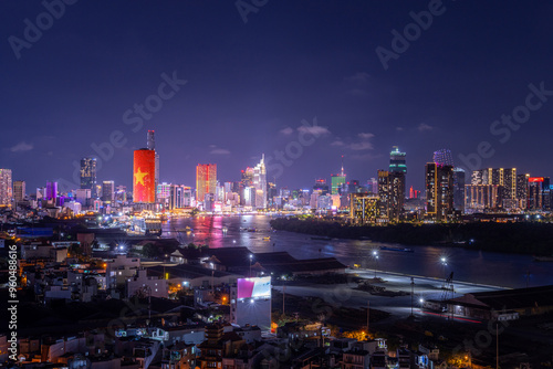 Aerial view of Ho Chi Minh City skyline and skyscrapers on Saigon river, center of heart business at downtown. Far away is Landmark 81 skyscraper