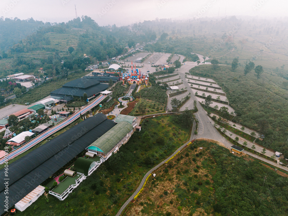 Fototapeta premium A tourist destination resembling a Disneyland-style castle located in a mountainous area of Bandung, offering picturesque views and a magical atmosphere for visitors