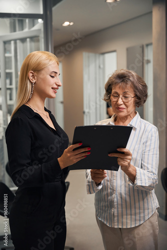 Lady signs documents in the lobby of a dental clinic