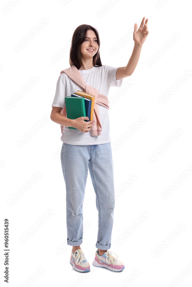 Smiling teenage girl with books waving on white background