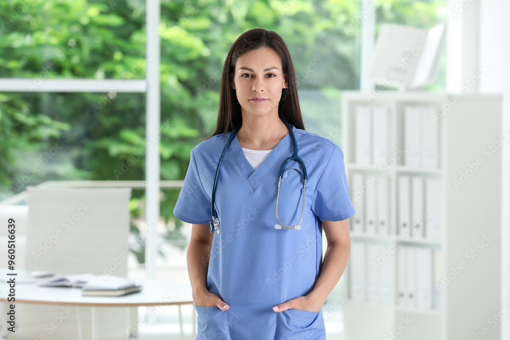 Beautiful nurse with stethoscope in hospital office Beautiful nurse with stethoscope in hospital office