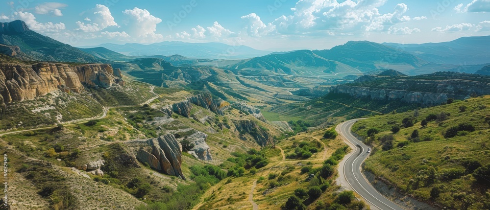 Majestic Mountain Pass: Aerial View of Serpentine Road Cutting Through Scenic Landscape Majestic Mountain Pass: Aerial View of Serpentine Road Cutting Through Scenic Landscape