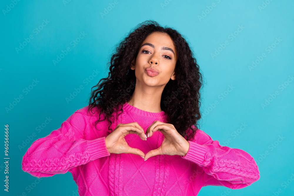 Portrait of nice young girl kiss show heart wear pink pullover isolated on turquoise color background Portrait of nice young girl kiss show heart wear pink pullover isolated on turquoise color background