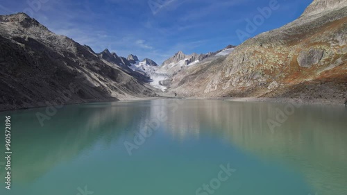 Aerial view of Oberaar lake (Oberaarsee) and Upper Aare Glacier (Oberaargletscher), Switzerland. 2x speeded up from 30 fps. photo