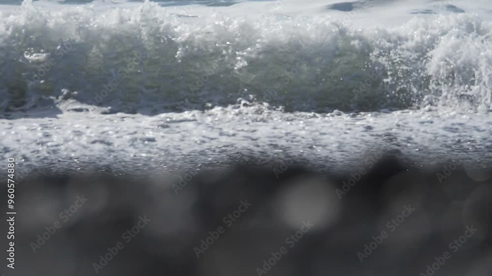Slow Motion. Foamy ocean waves moving towards the shore. Iceland. Slow Motion. Foamy ocean waves moving towards the shore. Iceland.
