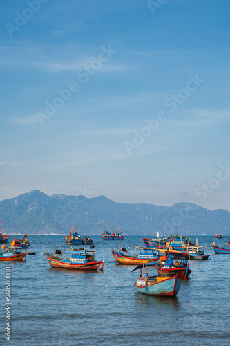 Vietnamese traditional boats at sea at port in a fishing village in Nha Trang in Vietnam at summer day photo