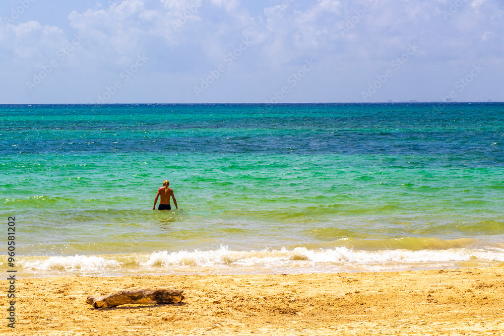 Male tourist man with long hair on Caribbean beach Mexico. Male tourist man with long hair on Caribbean beach Mexico.