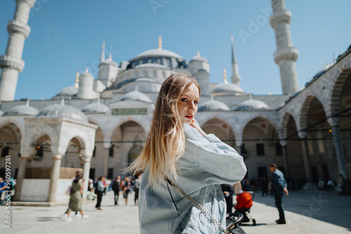 Photography Girl in the Blue Mosque in Istanbul, Turkey. High quality photo