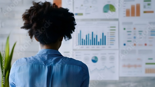 Person looking at a debt payoff progress chart, goal-oriented debt management