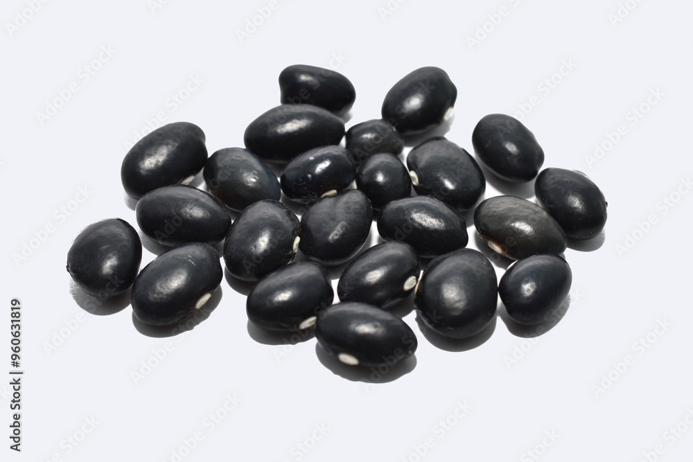 Small black beans on a white background. Small black beans on a white background.