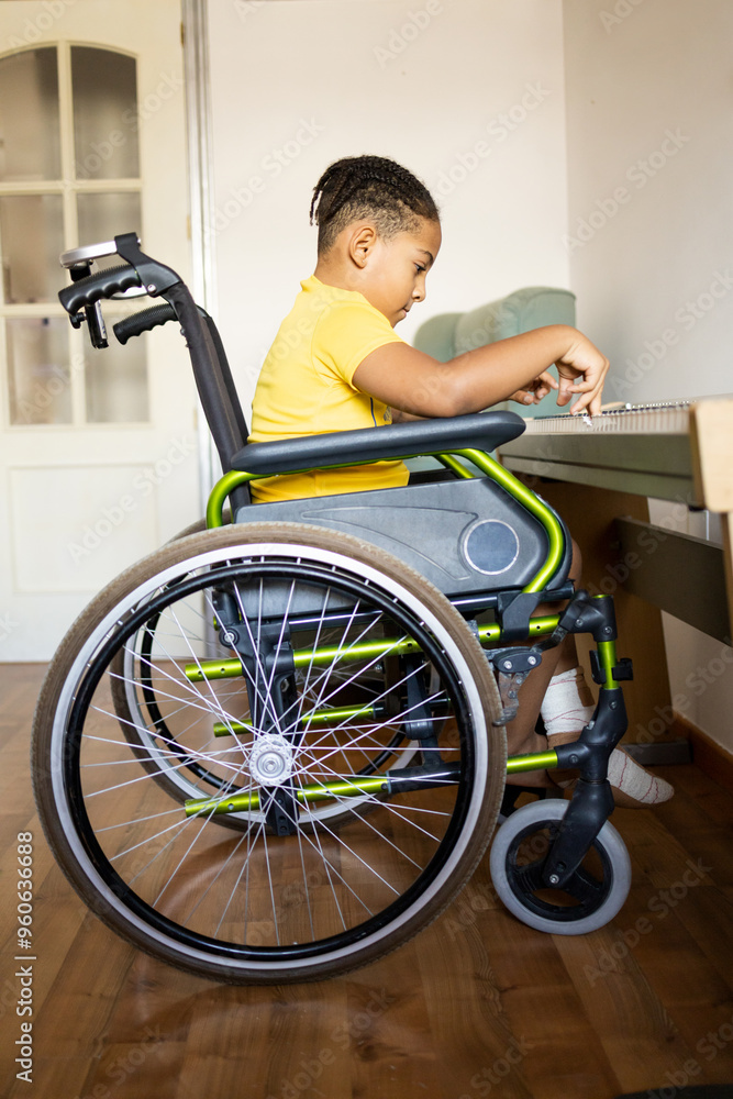 Vertical photo of a Latino boy between the ages of 8 and 9 playing an