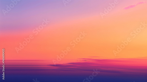 Stunning gradient sunset featuring warm oranges and purples reflected on a tranquil water surface, creating a serene and picturesque landscape