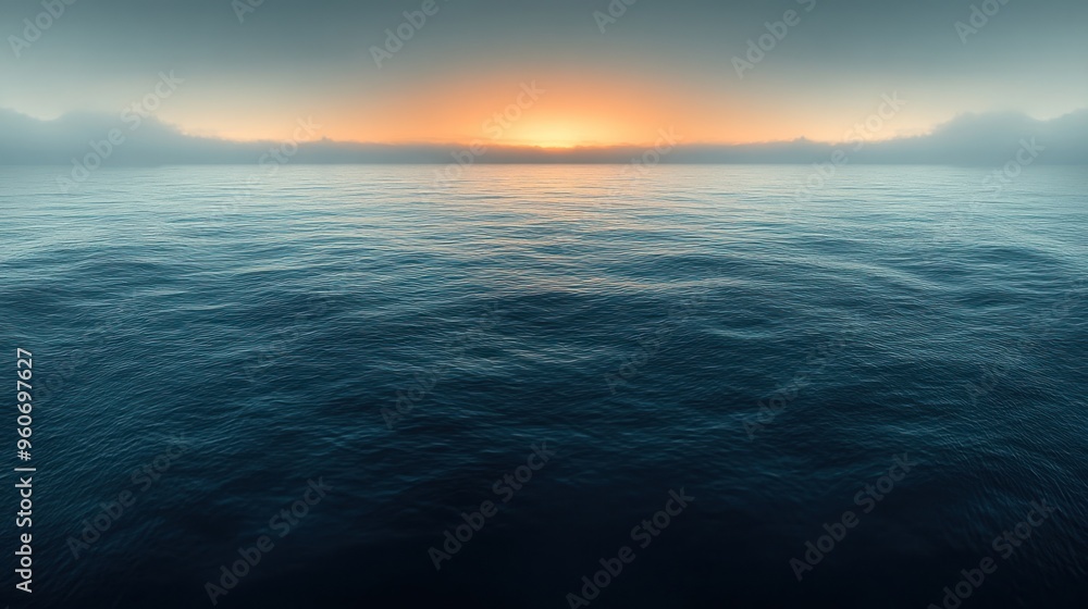 Fototapeta premium Gentle waves roll in as the sun rises, casting a serene ambiance over the tranquil ocean waters