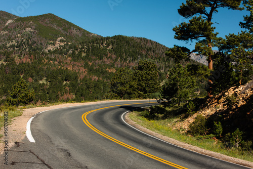 The mountain road curves towards Trail Ridge Road within Rocky Mountain National Park, Colorado. 