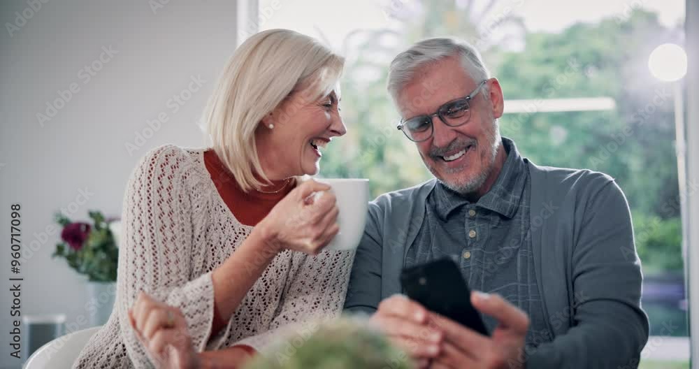 Senior couple, phone and coffee in home with funny website post or digital video with laughing. Chat, love and tea with marriage of people in a living room with communication, fun and streaming Senior couple, phone and coffee in home with funny website post or digital video with laughing. Chat, love and tea with marriage of people in a living room with communication, fun and streaming