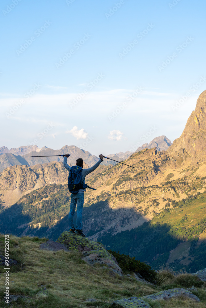 Back view of a man hiking in the French Pyrenees Back view of a man hiking in the French Pyrenees