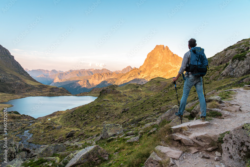 Man hiking in the French Pyrenees at sunset Man hiking in the French Pyrenees at sunset