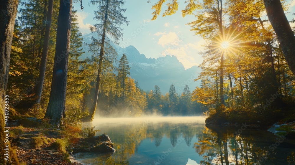 Obraz premium Sunset scene near Hintersee lake with trees and turquoise water in autumn