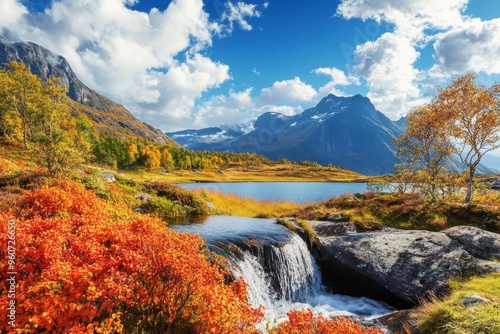 Norway's Lofoten Islands, a waterfall surrounded by autumnal forest and mountains on the road to Mount Munkan and Munkebu houses. photo