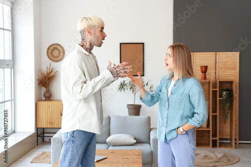 Young couple quarreling at ...
