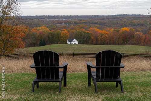 The countryside of Charlottesville winery vineyard in the blue ridge mountains of Virginia in autumn with empty wooden chairs during autumn foliage season