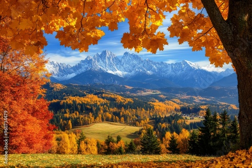 Stunning sunrise under the Tatra Mountains with red and yellow trees.