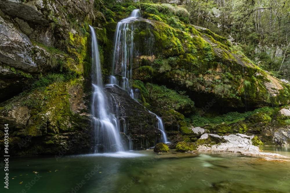 Long exposure photograph of the waterfall Virje on a summer day near Bovec, Slovenia Long exposure photograph of the waterfall Virje on a summer day near Bovec, Slovenia