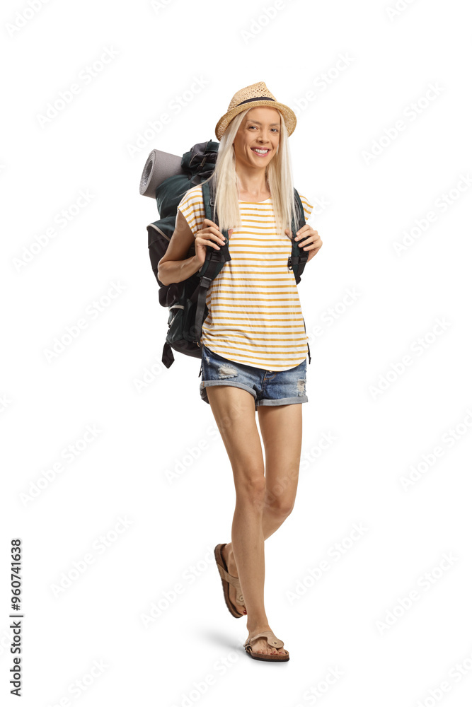 Female tourist carrying a backpack and walking Female tourist carrying a backpack and walking