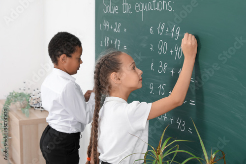 Little classmates writing o...