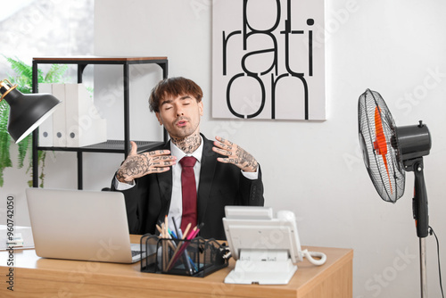Sweaty young businessman wi...