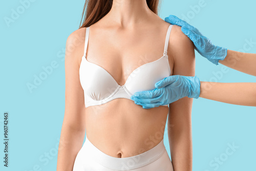 Plastic surgeon touching wo...
