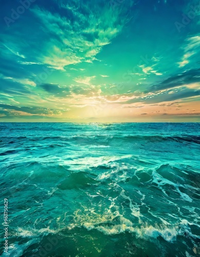 A breathtaking view of the ocean at sunset, with vibrant turquoise waves crashing towards the shore under a sky painted in warm hues. The image exudes tranquility and the beauty of nature