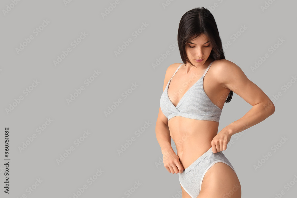 Young woman in underwear on light background Young woman in underwear on light background