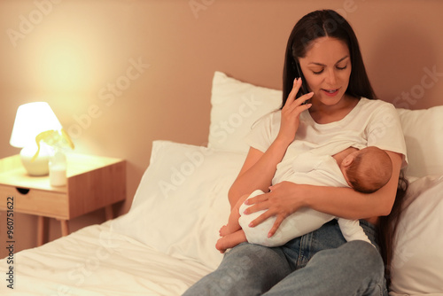 Mother breastfeeding her ba...