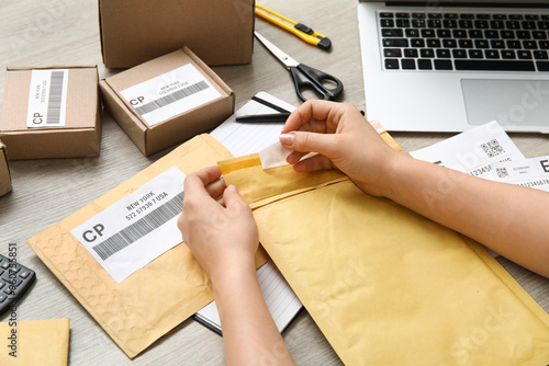 Female postal worker with p...