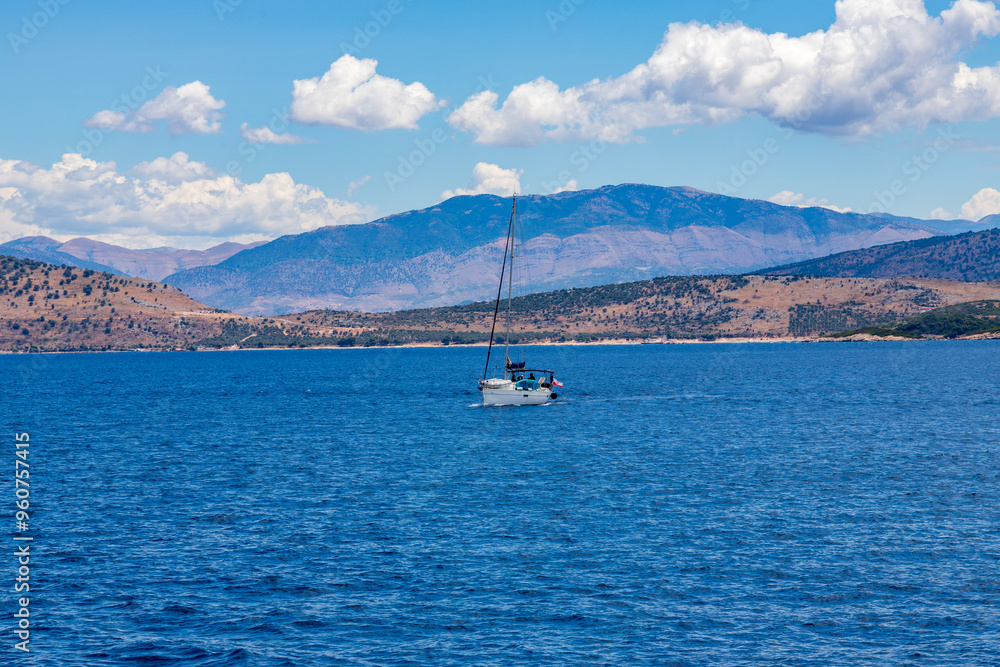 A single small boat in the water around Corfu, Greece A single small boat in the water around Corfu, Greece