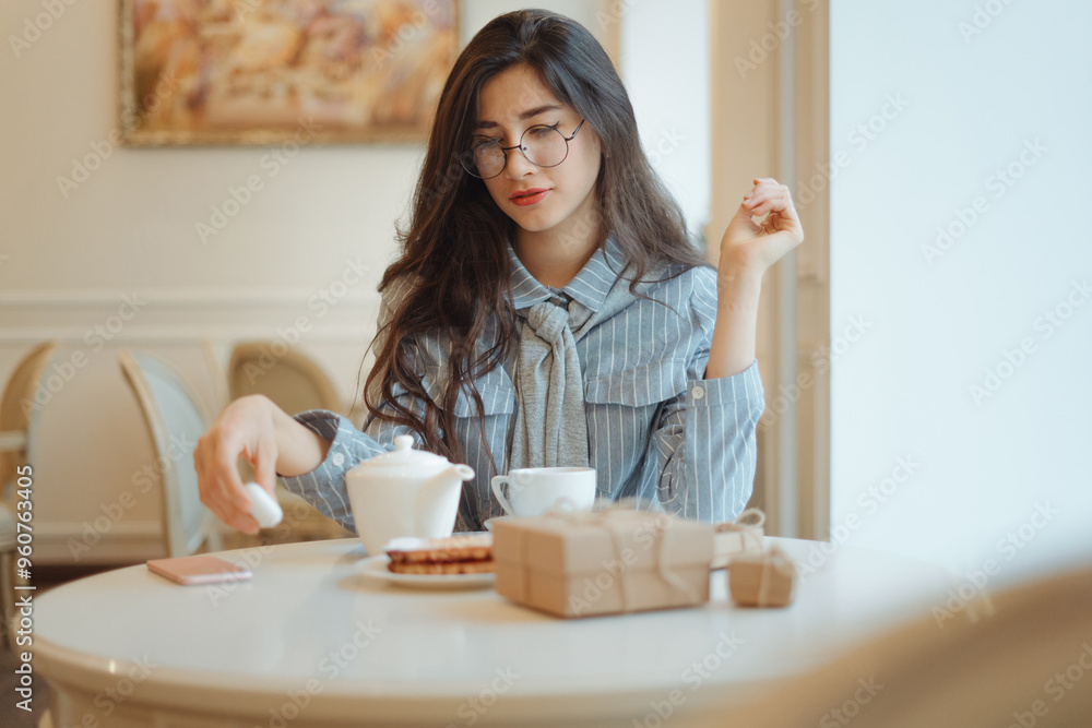 beautiful asian girl enjoying an hot tea in cafe beautiful asian girl enjoying an hot tea in cafe