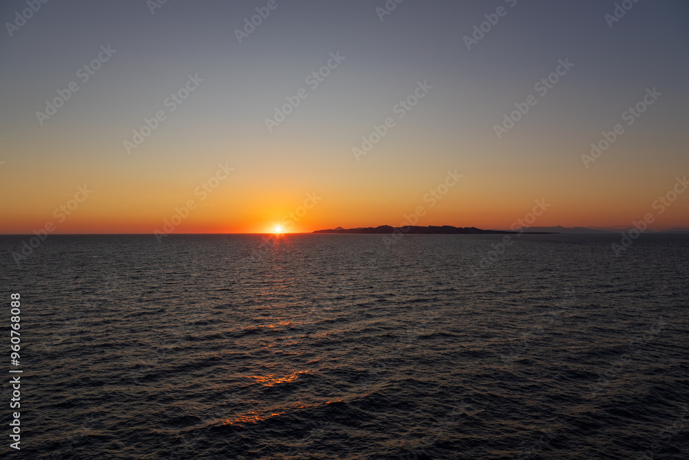 Greek sunsets over the Aegean sea during summer Greek sunsets over the Aegean sea during summer