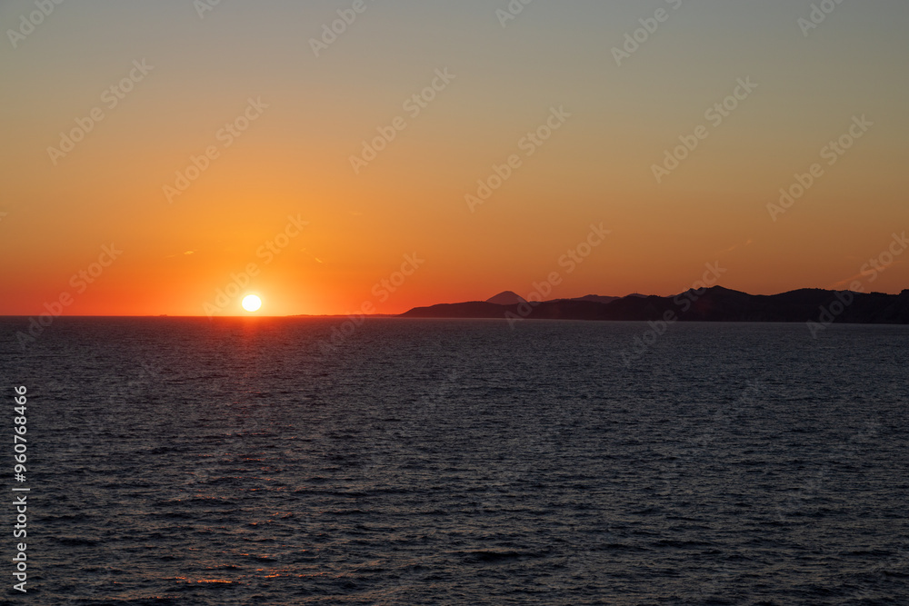 Greek sunsets over the Aegean sea during summer Greek sunsets over the Aegean sea during summer