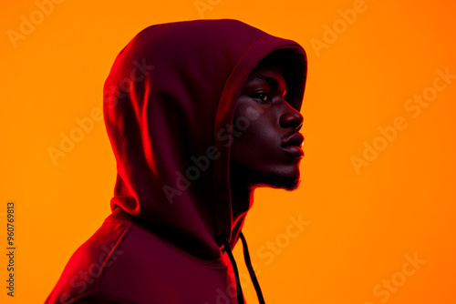 Mens Burgundy Hoodie with Solid Neon Orange Accents, Trendy Lifestyle Portrait with a Fashionable Twist photo