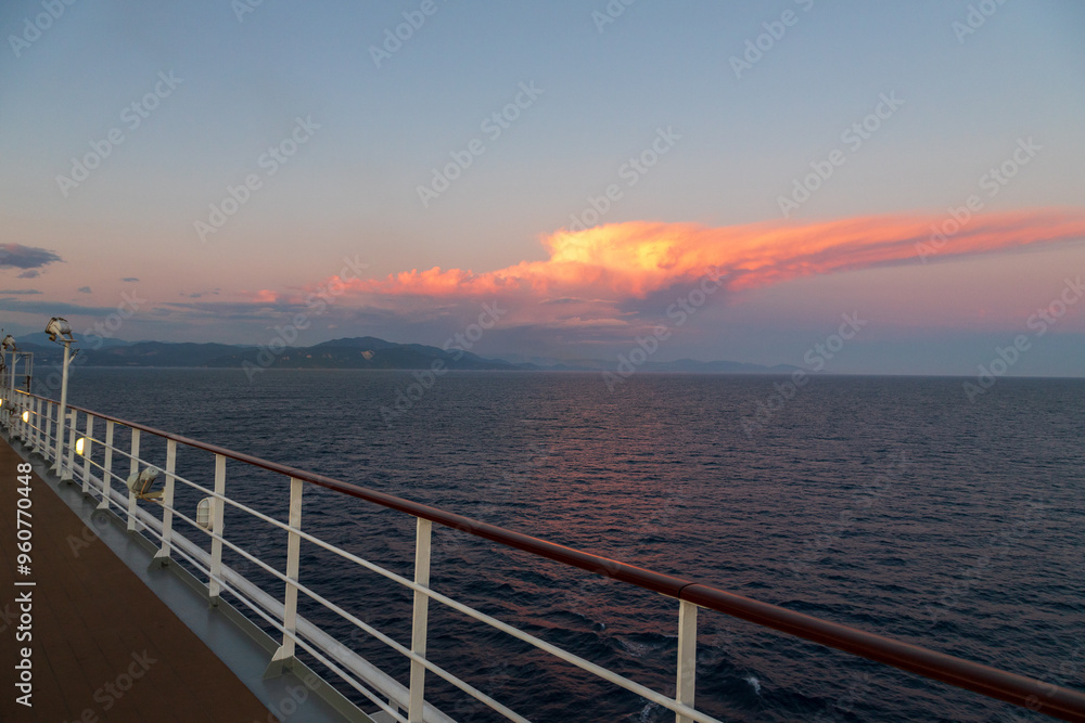 Greek sunsets over the Aegean sea during summer from the open deck of a cruise ship Greek sunsets over the Aegean sea during summer from the open deck of a cruise ship